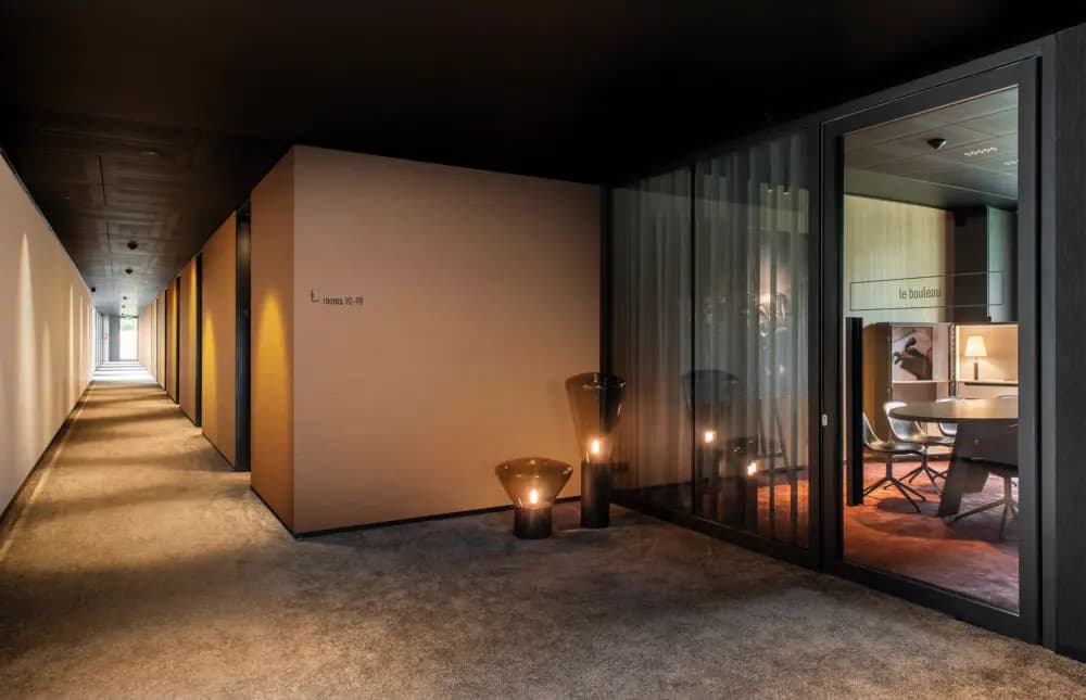 Hotel corridor papered in High Performance Textures Silky by Omexco (HPT502)